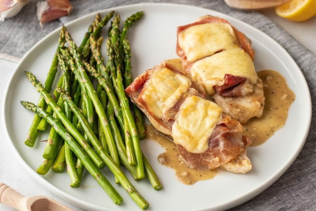 Chicken Cordon Bleu with roasted asparagus and lemon butter